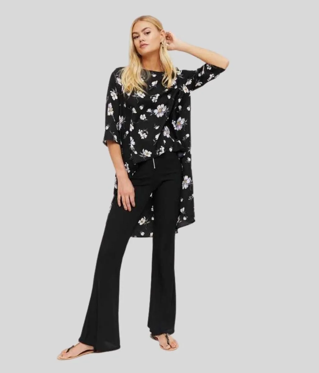Unstructured Fit Earthy Tone Colorways Black Floral Dipped Hem Top