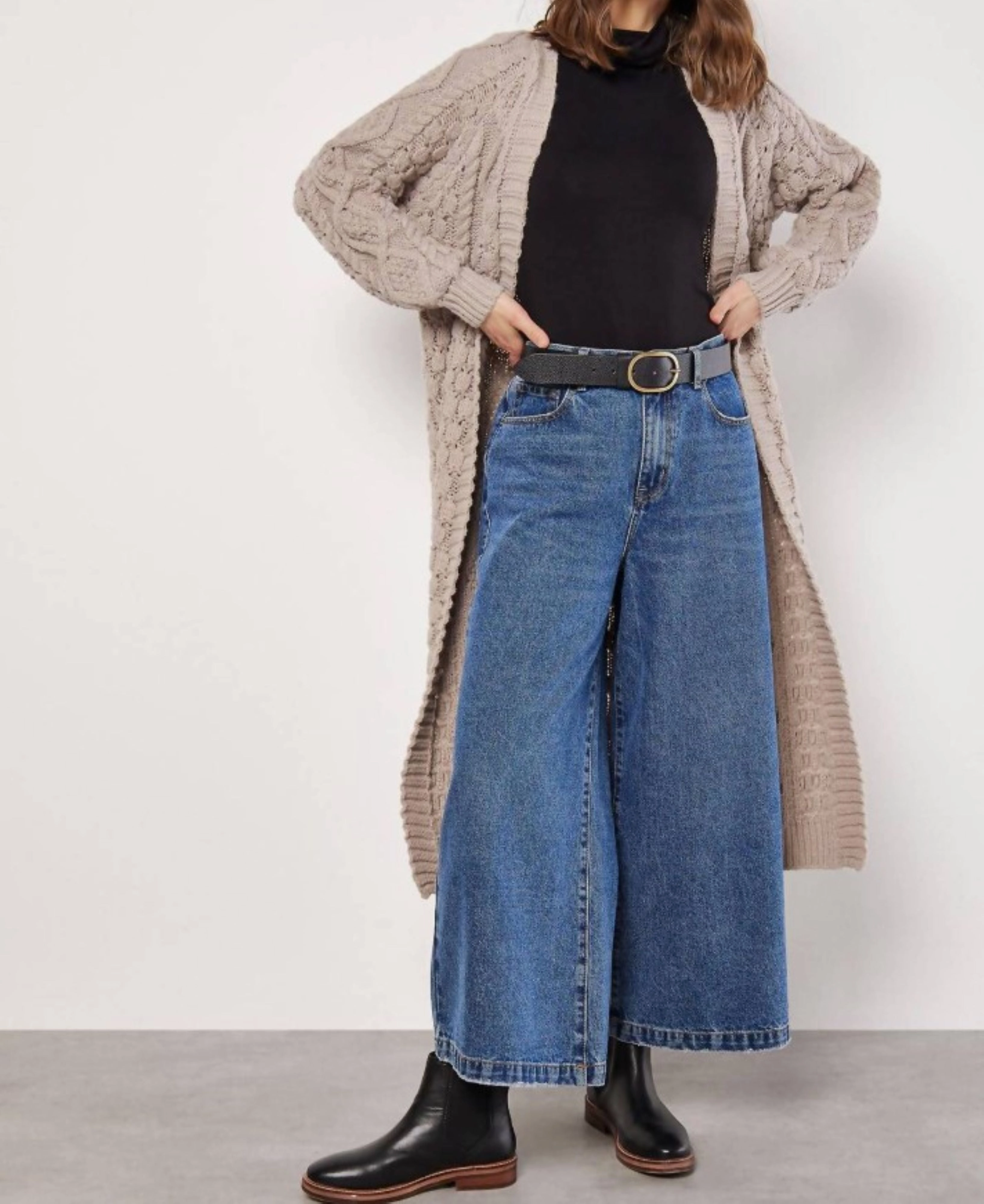 Cozy And Stylish Chilly Wear Rumored chunky cable knit midi-cardigan